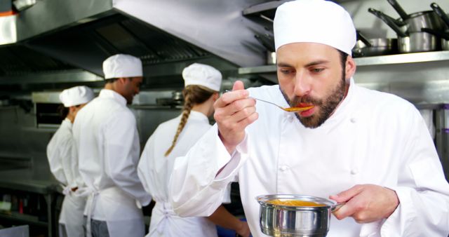 Chef Tasting Soup in Busy Restaurant Kitchen during Service - Download Free Stock Images Pikwizard.com