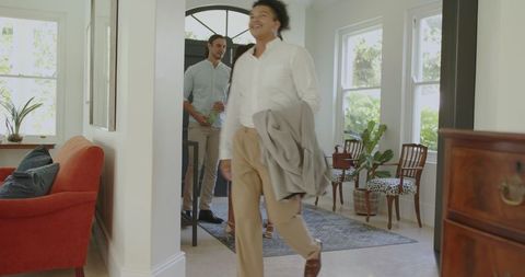 Guests Socializing at Lively Wedding Celebration Indoors