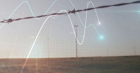 Barbed Wire Fence Over Sunset Plain with Wind Turbines and Data Visualization