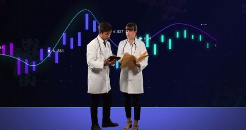 Doctors Analyzing Financial Data and Charts Representation