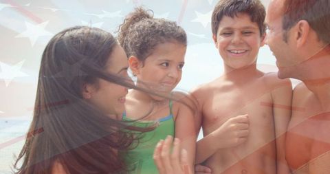 Joyful Family Bonding on Beach with National Flag Enhancement