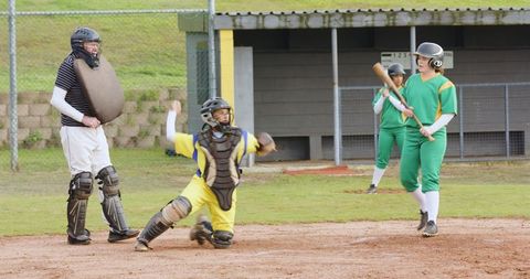 Youth Baseball Moment Catching Ball Near Batter and Umpire