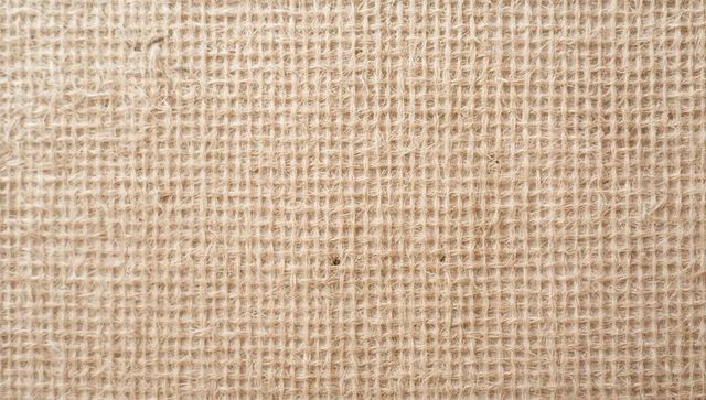 Revealing coarse burlap texture with jute weave pattern and natural beige fibers