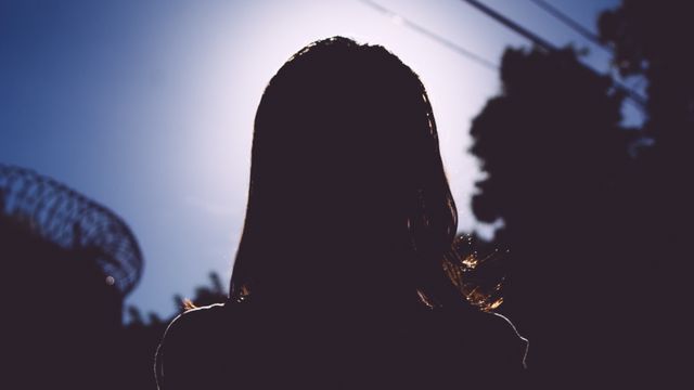 Silhouette of Woman Outdoors in Evening Light - Download Free Stock Photos Pikwizard.com