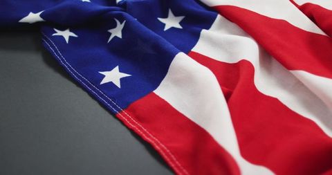 Crumpled American Flag on Gray Background
