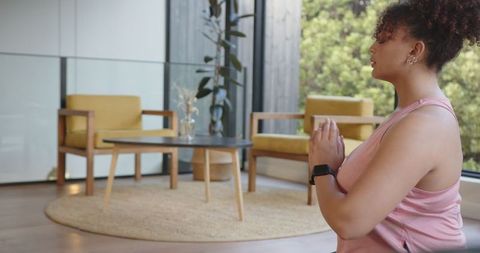 African American Woman Practicing Mindfulness in Stylish Living Room