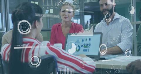 Business Team Reviewing Data on Laptop with Augmented HUD Analytics