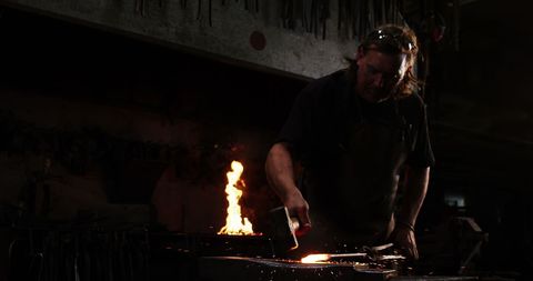 Blacksmith Crafting in Workshop with Flame and Sparks - Download Free Stock Images Pikwizard.com