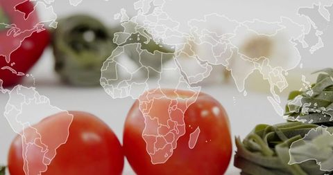 Glossy Cherry Tomatoes with Green Tagliatelle and World Map Overlay Global Food Concept