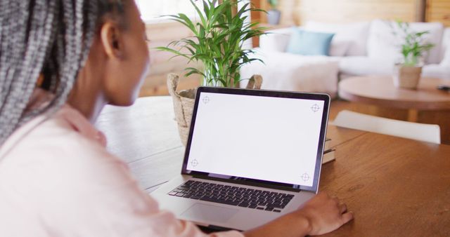 Woman Working on Laptop with Blank Screen in Cozy Home Office - Download Free Stock Images Pikwizard.com