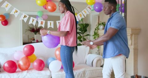 Preparation for a Children's Home Birthday Party with Balloons