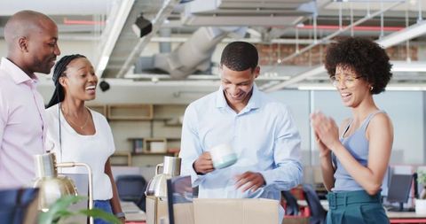 Excited Office Team Celebrating Gift Exchange