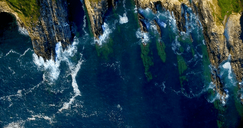 stunning aerial seascape of natural rock formations with transparent waters - Download Free Stock Videos Pikwizard.com