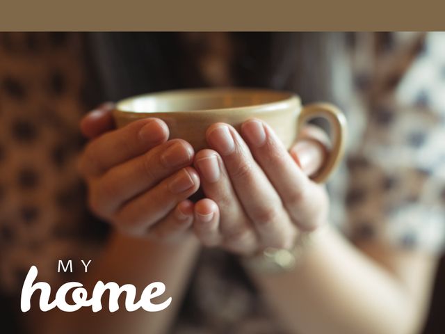 Ideal for illustrating comfort and tranquil moments in a cozy setting, this visual captures warm hands holding a coffee cup. Perfect for promoting cafes, coffee shops, relaxation products, and lifestyle blogs focusing on homey, comforting themes. Can also be used in advertising campaigns for coffee brands or wellness products.