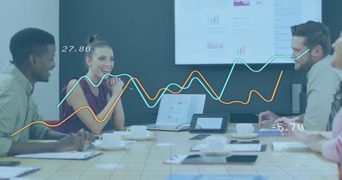 Diverse Business Meeting with Digital Financial Interfaces