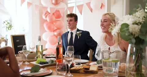 Newlyweds celebrate at intimate home wedding ceremony with friends