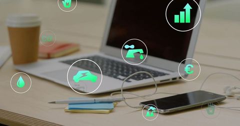 Tapping Smartphone While Analyzing Financial Growth and Eco Icons on Laptop Workspace