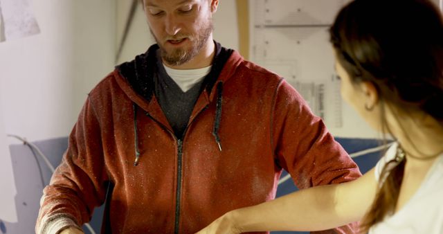 Man and woman collaborating in wood workshop, working on project - Download Free Stock Images Pikwizard.com