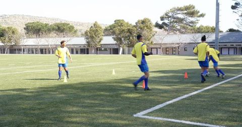 Boys Practicing Soccer Drills Focusing on Teamwork and Skills
