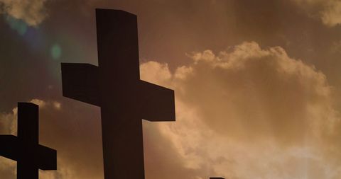 Silhouette of Large Crucifix Against Dramatic Sunset Sky - Download Free Stock Images Pikwizard.com