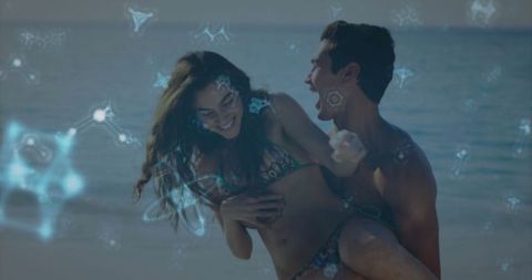 Joyful couple embracing beach romance with futuristic flair
