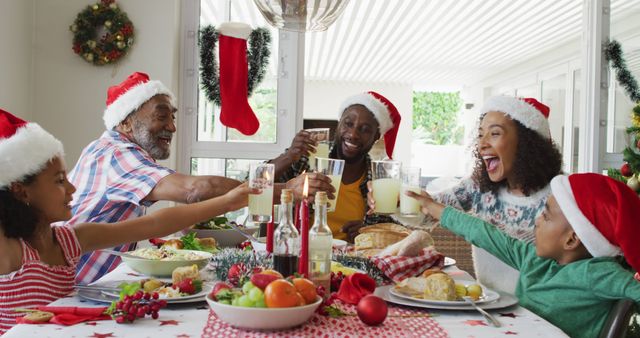 Happy family celebrating Christmas with festive meal - Download Free Stock Images Pikwizard.com