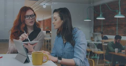 Collaboration of Businesswomen in Modern Office Space