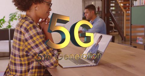 Diverse Professionals Utilizing 5G Technology in Modern Workspace