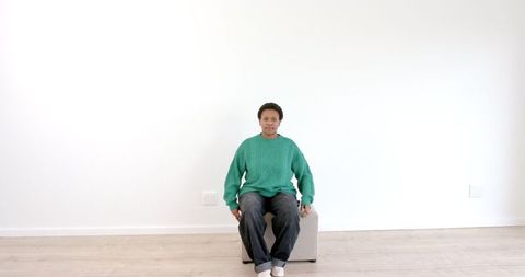 Calm Portrait of Person in Green Sweater Indoors