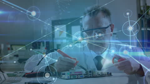 Senior Scientist Conducting Circuit Board Surgery