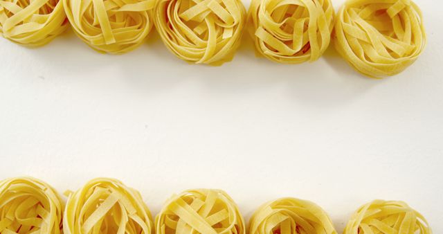 Uncooked Italian Fettuccine Nests on White Background - Download Free Stock Images Pikwizard.com