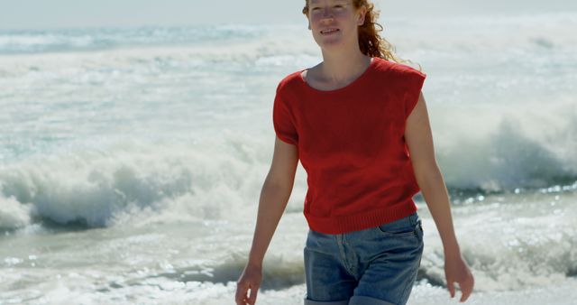 Happy Young Woman Walking Along Beach Shore on Sunny Day - Download Free Stock Images Pikwizard.com