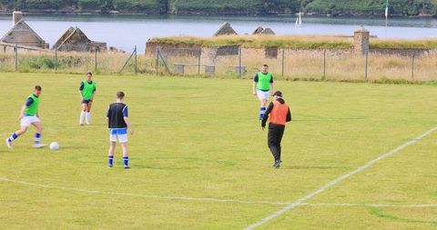 Teenage Soccer Players Training Near Riverfront