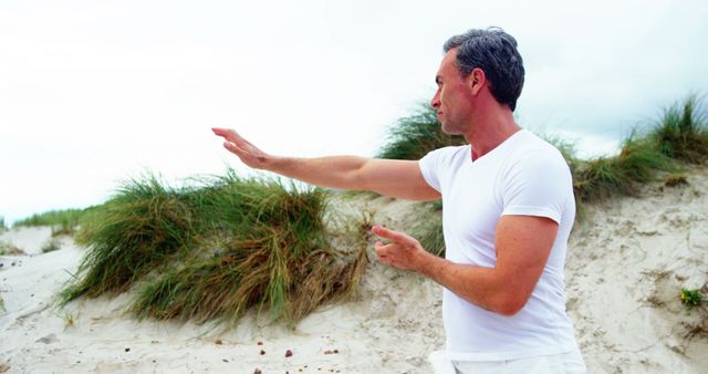 Middle-Aged Man Practicing Tai Chi in Nature - Download Free Stock Images Pikwizard.com