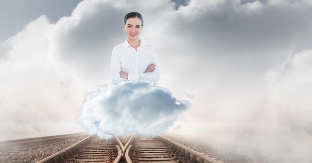 Digital composite of Digitally generated image of businesswoman on railroad track against cloudy sky