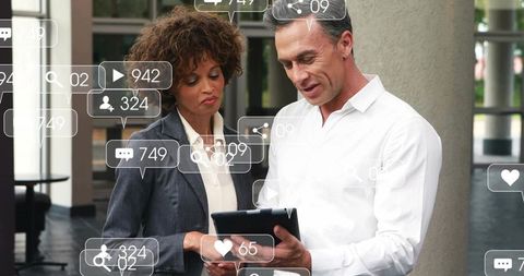 Business Professionals Engaging with Digital Technology in Corporate Environment