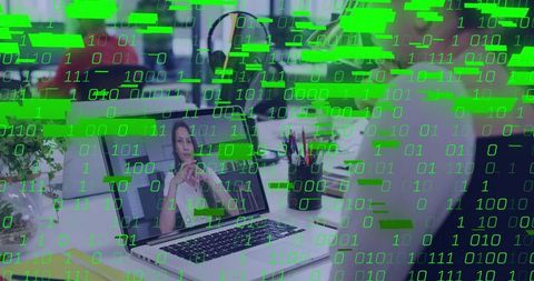 Remote video conference connecting mature professional with digital binary data overlay