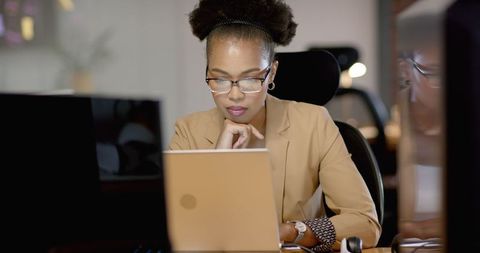 Focused African American Businesswoman Working at Laptop