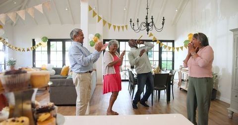 Joyful Seniors Celebrating Birthday with Music and Laughter