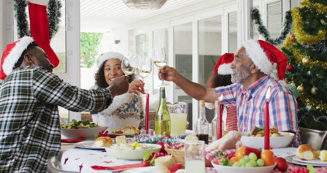 Family Celebrating Christmas with Festive Dinner and Wine Toast - Download Free Stock Images Pikwizard.com