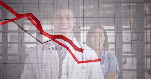 Doctors smiling behind falling red graph illustrating healthcare analytics and cost trends