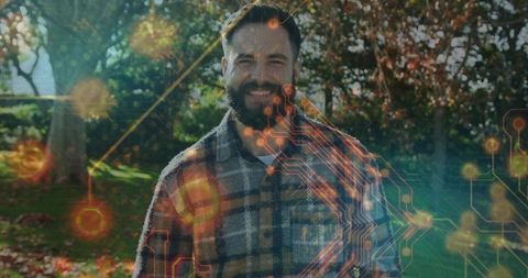 Man with digital circuit overlay enjoying autumn garden