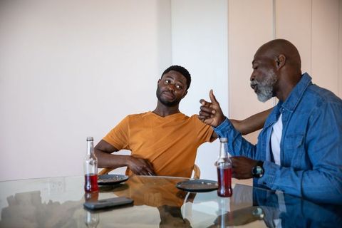 Family Bonding Moment Between Father and Son at Home