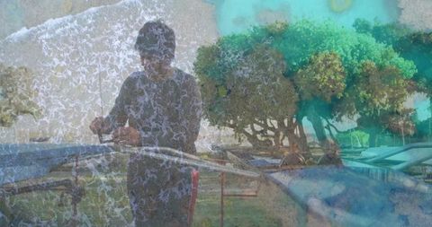 Senior woman adjusting surfboard straps at coastal park