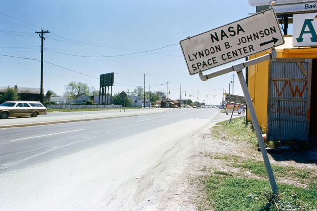 View of road sign pointing in the direction of the NASA Lyndon B. Johnson Space Center.