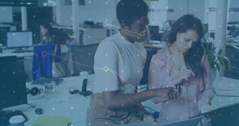 Collaborative Teamwork in Modern Office with Digital Technology