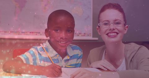 Dedicated Teacher Supporting Young Student in Classroom Setting