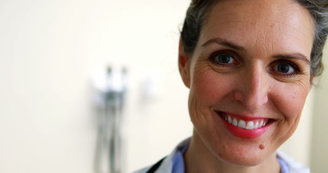 Smiling Female Doctor with Lab Coat and Stethoscope in Medical Office - Download Free Stock Images Pikwizard.com