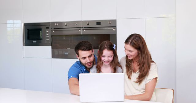 Happy Family Bonding Over Laptop in Modern Kitchen - Download Free Stock Images Pikwizard.com