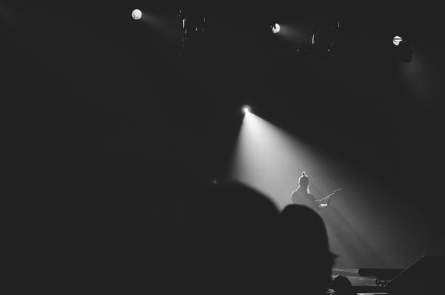 Guitarist Performing on Stage under Spotlight - Download Free Stock Photos Pikwizard.com